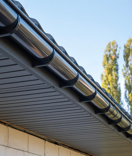 Black half round gutters corrugated metal roof